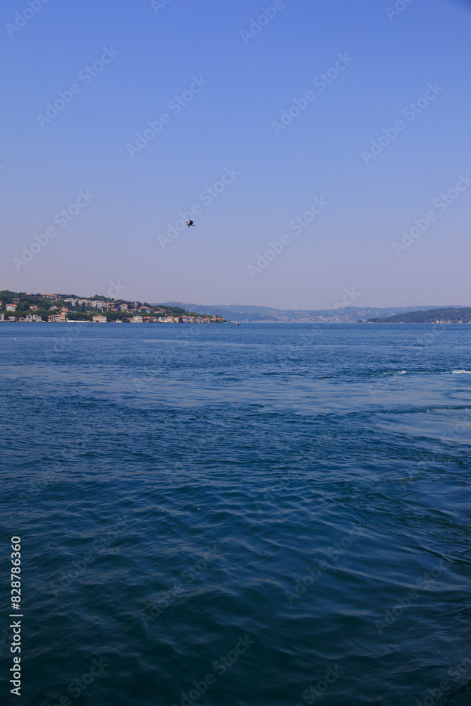 Turquoise blue sea water. View of the Bosphorus in Istanbul city on sunny summer day, in a public place. Turquoise blue sea water. View of the Bosphorus in Istanbul city on sunny summer day, in a public place.