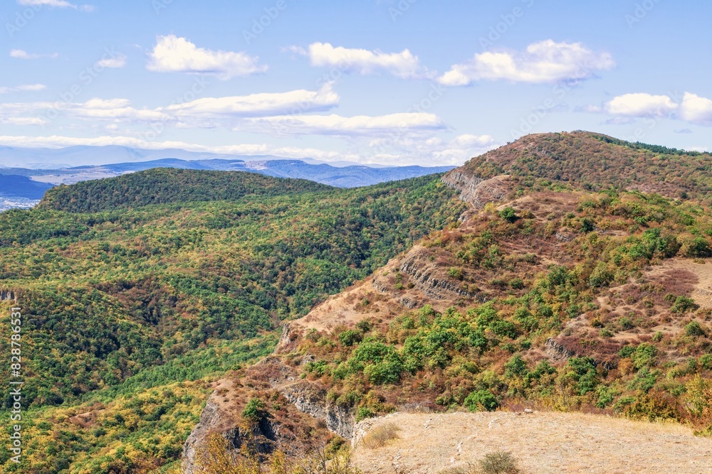Fototapeta premium This stunning landscape features a beautiful mix of rolling hills, lush forests, and a serene blue sky. The scene is perfect for a relaxing getaway or an adventurous hike. Kiketi, Georgia.