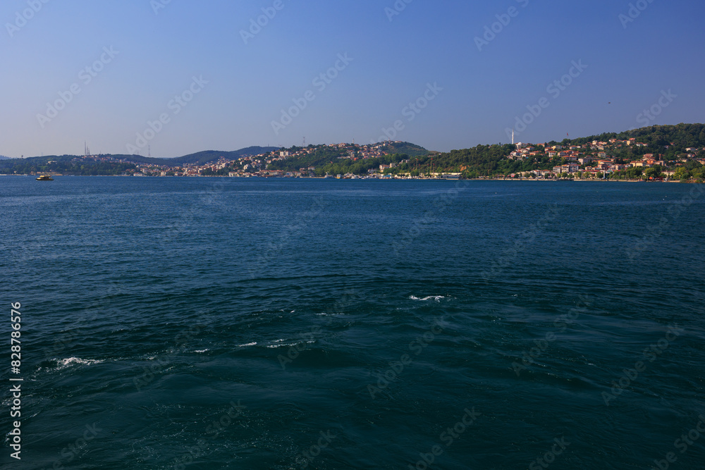 Turquoise blue sea water. View of the Bosphorus in Istanbul city on sunny summer day, in a public place. Turquoise blue sea water. View of the Bosphorus in Istanbul city on sunny summer day, in a public place.