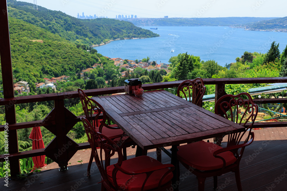 Fototapeta premium Beautiful views from above, tables in a cafe in the mountains and a panoramic view of the city, public places in Turkey, on a sunny summer day