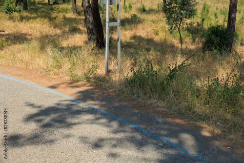 Fototapeta Naklejka Na Ścianę i Meble -  Beautiful road and landscape, streets and roads of a southern small town, public place in Turkey, on a summer sunny day