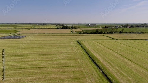 Aerial View: Green Grassland and Farmland in Friesland, Netherlands (ID: 828789750)