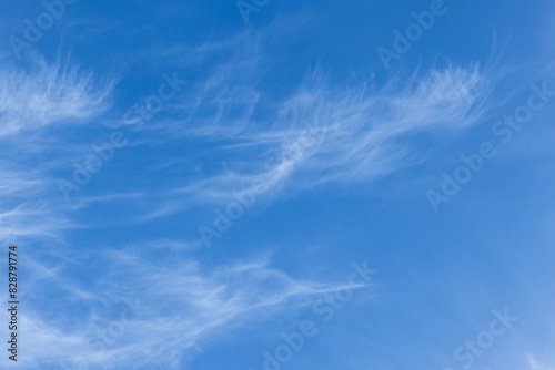 Fotografija The sky is blue and clear with a few clouds scattered throughout