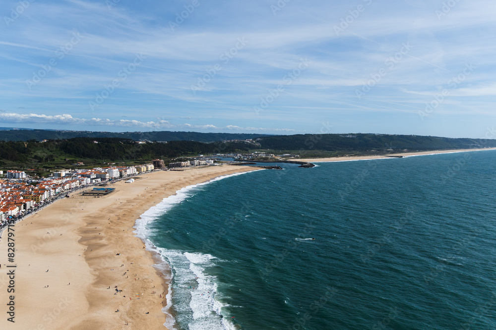 View from the hill to the sandy beach 'Praia da Nazaré' , Praia do Norte beach and Nazare town, Portugal