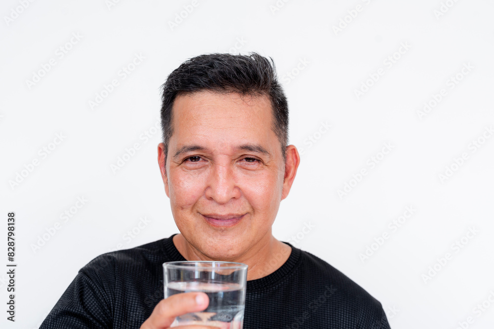 A joyful middle-aged Asian man holding a cold glass of water, isolated on a white background. A joyful middle-aged Asian man holding a cold glass of water, isolated on a white background.