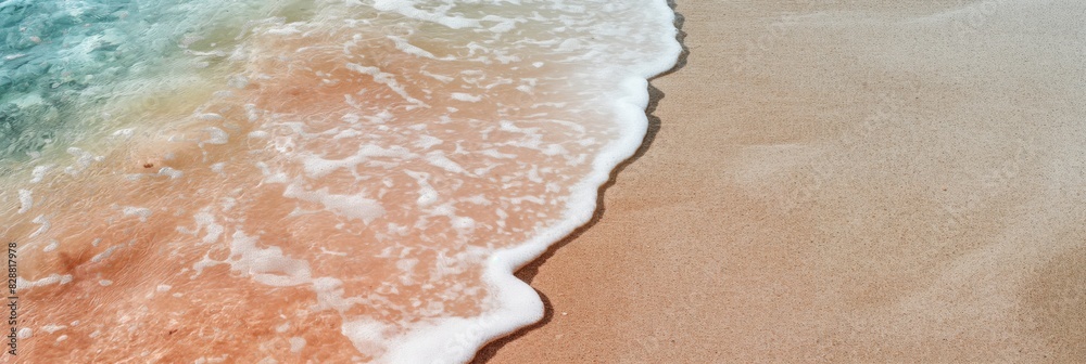 Fototapeta premium A tranquil scene capturing the gentle meeting of ocean waves with a pristine sandy beach, showcasing nature's simplicity