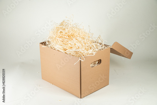 Cardboard box with wood filling on a white background