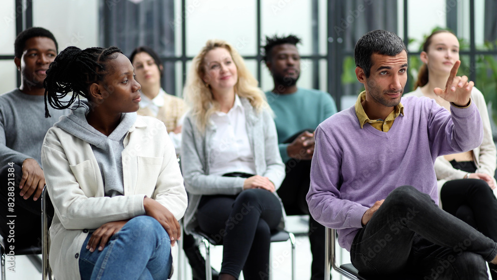 young people shaking hands in a circle of like-minded people