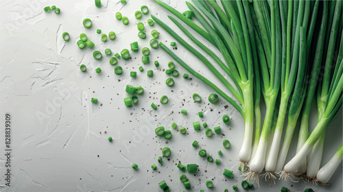 Fresh green onions on a white background with space for text banner, cover, print. Finely chopped green onions, greens for salads and dishes, spices. Culinary background. Spring greens salad.	