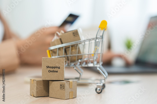 internet shopping e commerce concept, Parcel boxes of product on laptop computer related buy from online store. photo