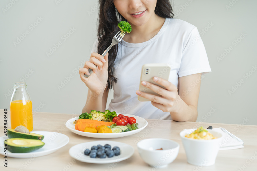 young female planning menu to eat ketogenic diet during weight loss program. young female planning menu to eat ketogenic diet during weight loss program.
