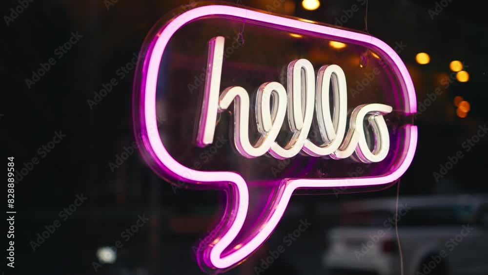Neon sign with a Hello speech bubble, glowing in the night city street art background Neon sign with a Hello speech bubble, glowing in the night city street art background