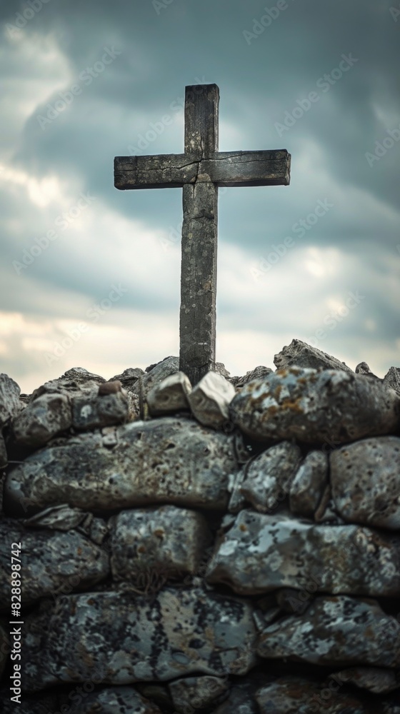 A cross is positioned on top of a stack of rocks A cross is positioned on top of a stack of rocks