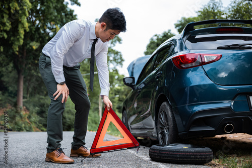 Wallpaper Mural Man having car trouble and stranded at roadside with red warning triangle behind his broken car. Waiting for emergency assistance and transportation services. Torontodigital.ca