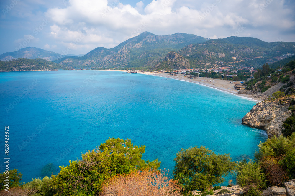 Aerial view of Oludeniz beach with people and boats in the morning, Coastline next to Fethiye, Turkey Aerial view of Oludeniz beach with people and boats in the morning, Coastline next to Fethiye, Turkey