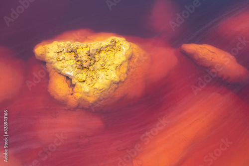 Vibrant mineral formations in the waters of Riotinto