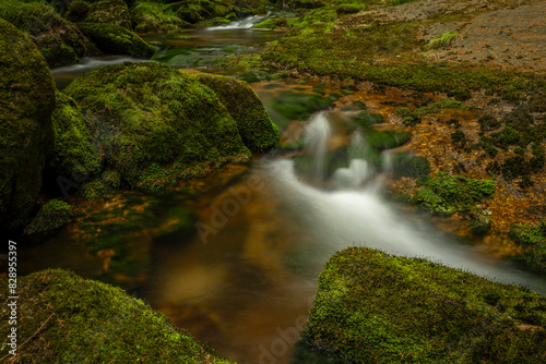 Waterfall of Kamenice in spring sunny cloudy day in Jizerske mountains