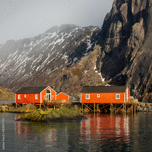 red houses on the shore of lake on the Lofoten