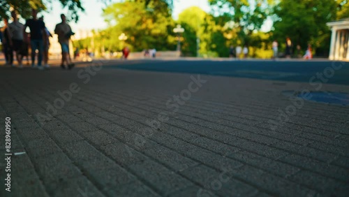 Wallpaper Mural A sunny day in the city capturing an urban sidewalk lined with trees and people in the background Torontodigital.ca