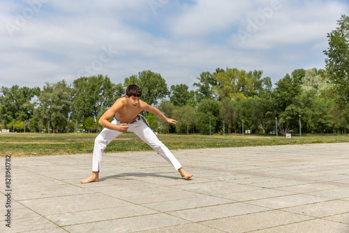 Teenager practicing capoeira , brazilian martial art