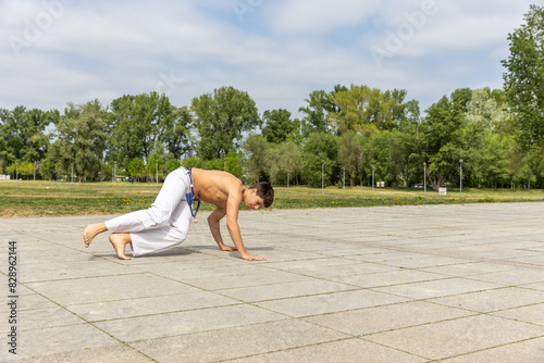 Teenager practicing capoeira , brazilian martial art