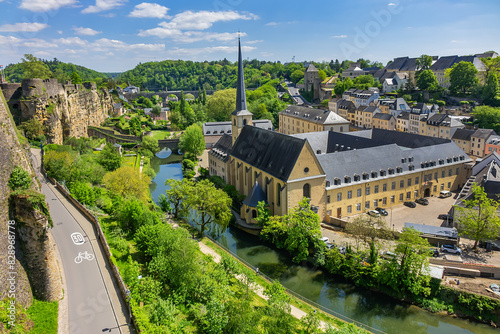 Saint John’s Church or Saint John on the Stone (Eglise Saint-Jean, 1705) in the valley and the river Alzette. Church St Jean of Grund belonged to the Benedictine Abbey of Munster. Luxembourg City. photo