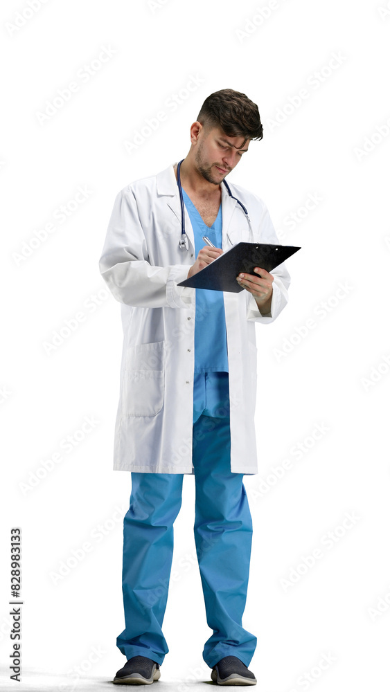The doctor, in full height, on a white background, writes The doctor, in full height, on a white background, writes