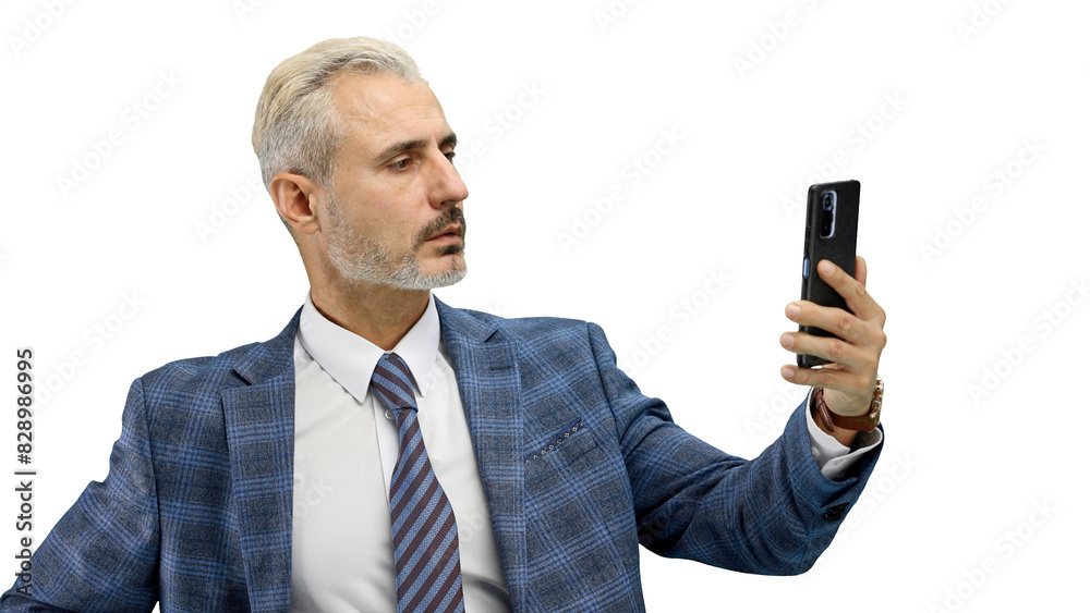 Man, close-up, on a white background, talking on the phone Man, close-up, on a white background, talking on the phone