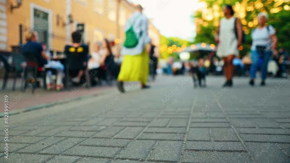 Captivated by the scene of pedestrians walking on cobblestone streets in a vibrant urban setting Captivated by the scene of pedestrians walking on cobblestone streets in a vibrant urban setting