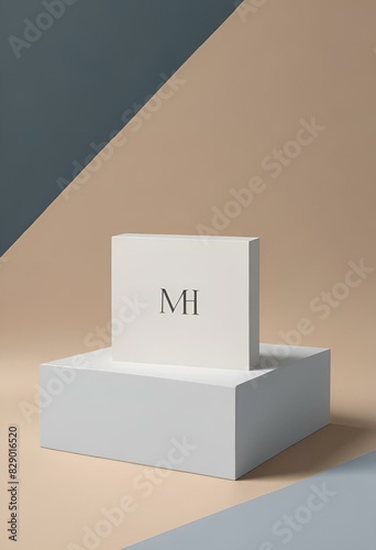 a minimal monogramed image of business cards placed on a block with an envelope photo