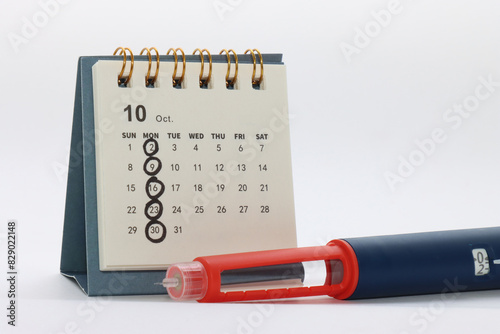 Basal Insulin weekly injection. Calendar with one day per week marked representing the day that the basal insulin will be apply.   photo