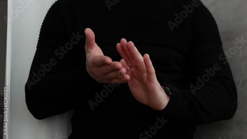 Extravagant funny applause. Clap hands, man in black clothes claps his hands, Ovation photo