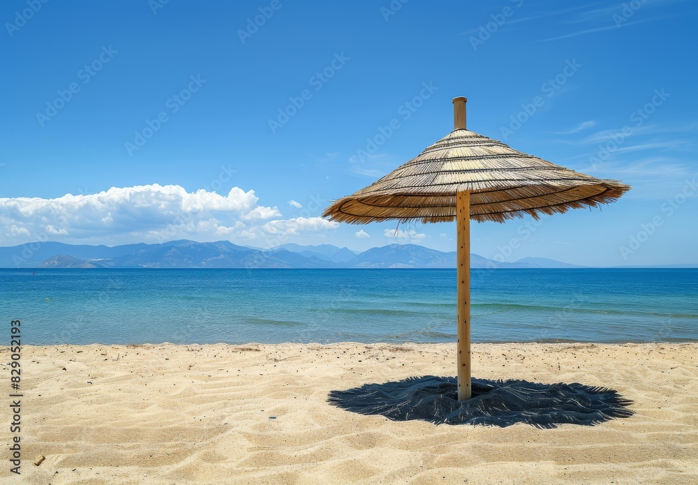 Summer beach: Paralia, Olympic Riviera, Pieria, Greece. Palm parasol shades the sand. Summer beach: Paralia, Olympic Riviera, Pieria, Greece. Palm parasol shades the sand.