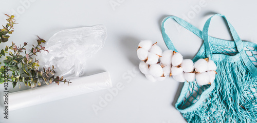 Choice between plastic bags and cotton bag on blue background top view web banner