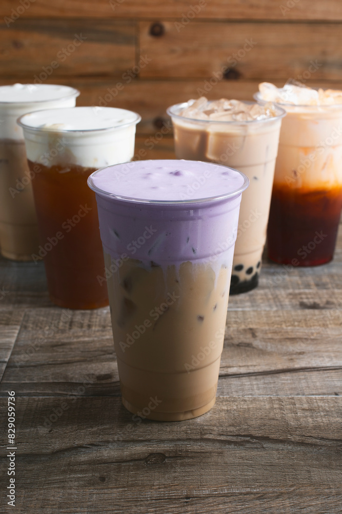 A view of a taro dalgona coffee drink, among other milk tea beverages. A view of a taro dalgona coffee drink, among other milk tea beverages.