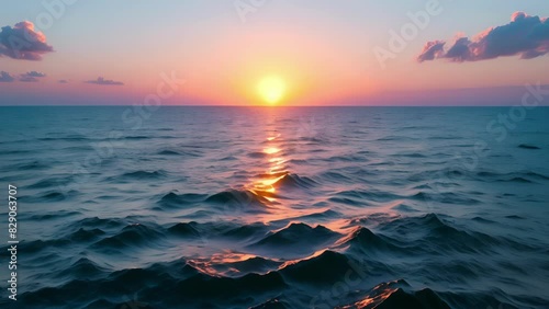 A serene sunset over the ocean with a caption reading By practicing sustainable seafood ods we are preserving this beautiful ecosystem for generations to come. photo