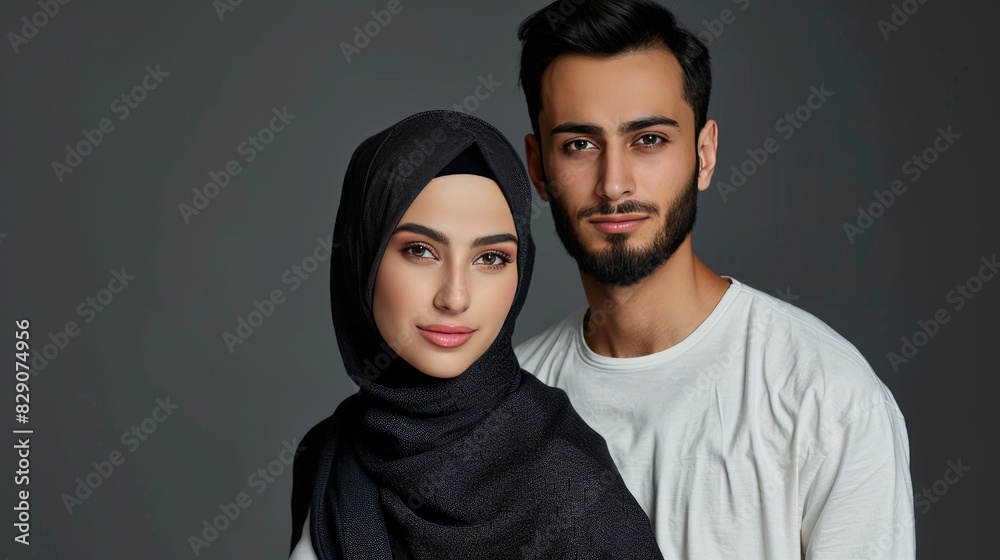 A man and woman wearing traditional clothing pose for a picture A man and woman wearing traditional clothing pose for a picture