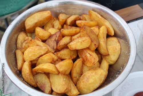 Close-up of deep-fried potatoes. Cooking in nature