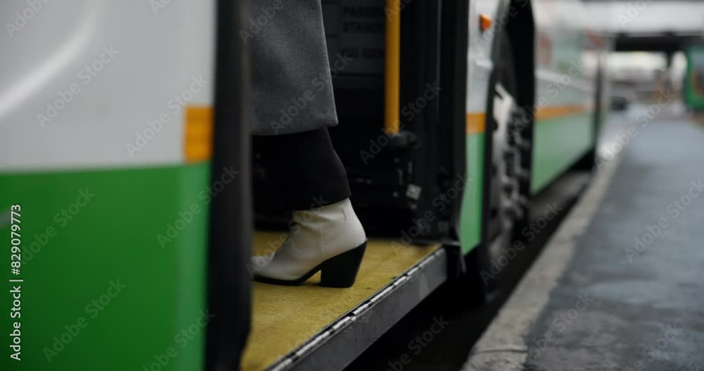 Walking, feet and outdoor in station, bus and person in morning, winter and routine to travel for work. Closeup, legs and foot of employee, ride and commute with vehicle for public and New York Walking, feet and outdoor in station, bus and person in morning, winter and routine to travel for work. Closeup, legs and foot of employee, ride and commute with vehicle for public and New York