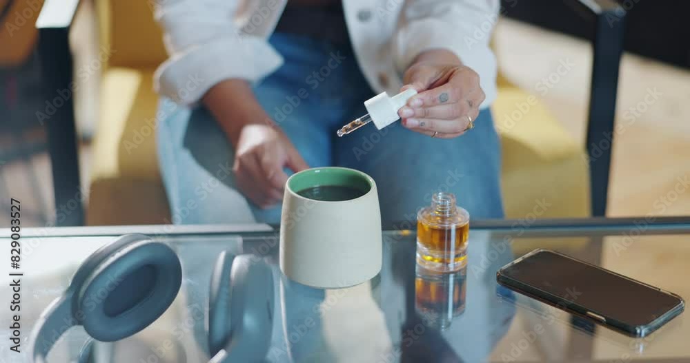 Woman, coffee and cup with cbd oil on table for organic medicine, benefits and mental health. Glass, product and person with drop of cannabis in beverage at home for natural, healing and support