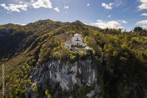 Aerial view of Santuario Madonna del Sasso on a rocky Santuario Madonna del Sasso, Verbano-Cusio-Ossola, Piedmont, Italy
