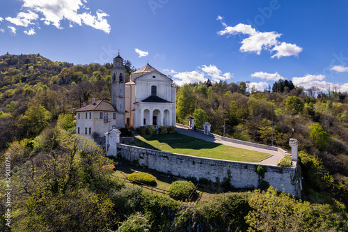 Aerial view of Santuario Madonna del Sasso on a rocky Santuario Madonna del Sasso, Verbano-Cusio-Ossola, Piedmont, Italy photo