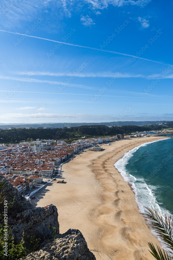 Fototapeta premium View from the hill to the sandy beach 'Praia da Nazaré' , Praia do Norte beach and Nazare town, Portugal
