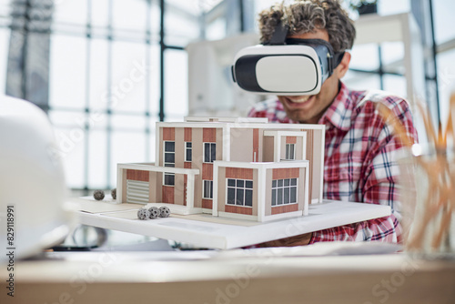 Virtual reality futuristic design technology. Architect or design engineer in VR headset for BIM technology