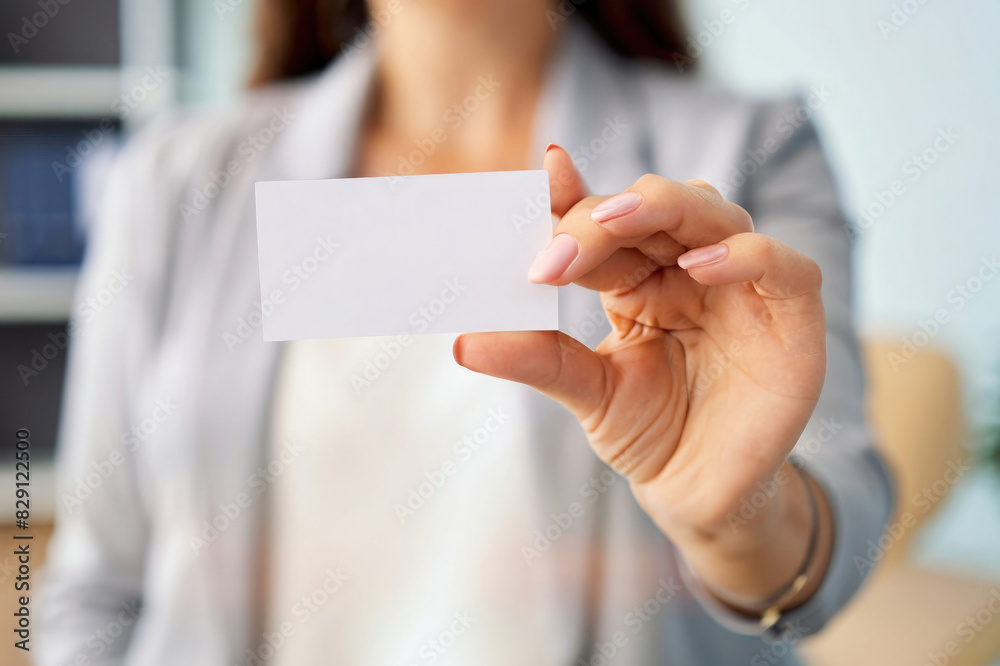 woman holding a business card woman holding a business card