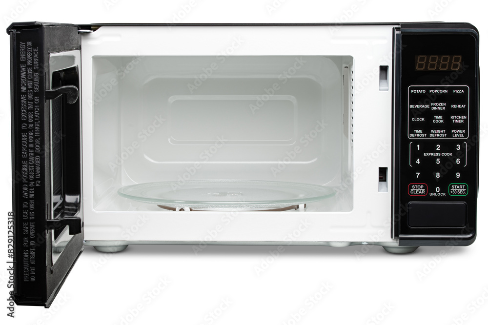 Obraz premium Microwave oven. Black microwave oven for warming food, drink, cooking lunch, defrost meat, cook meal. Electrical kitchen appliances. New equipment for house. Isolated Background