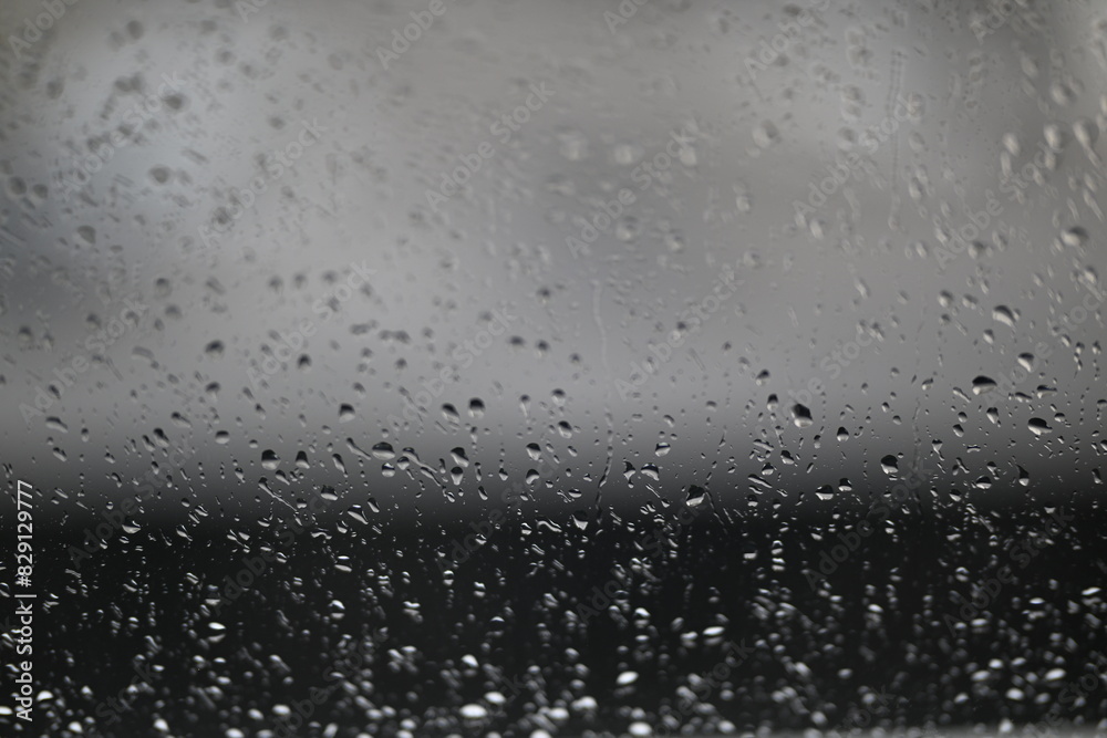 Water drops on fogged glass with a gray brightness gradient Water drops on fogged glass with a gray brightness gradient