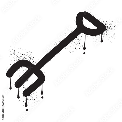 Pitchfork with black spray paint graffiti