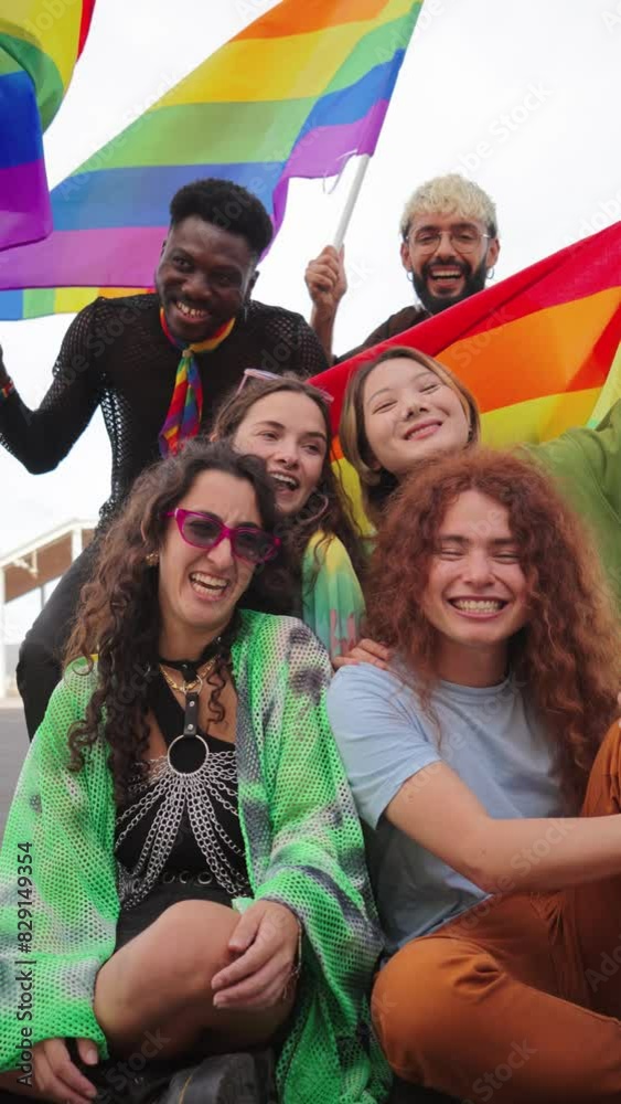 Vertical. Group of young LGBT poeple smiling celebrating together the ...