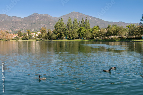 City of Rancho Santa Margarita, Orange County USA, view of the lake and mountains near the trees 